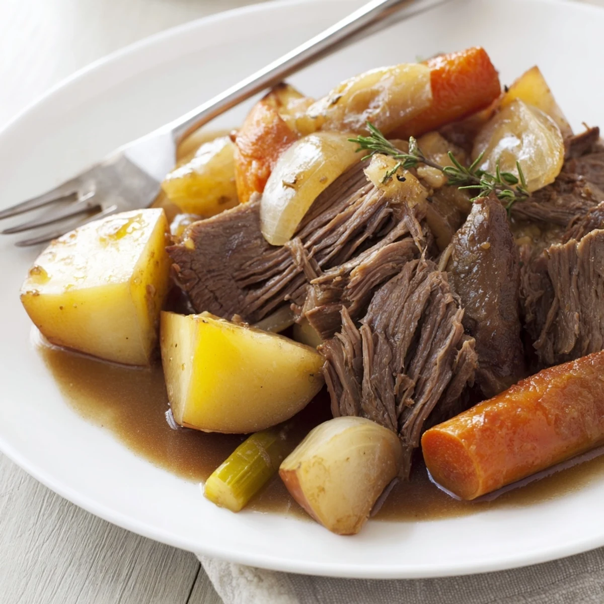 Slow Cooker Pot Roast with chunky vegetables and herbs in a rustic slow cooker, ready to serve.