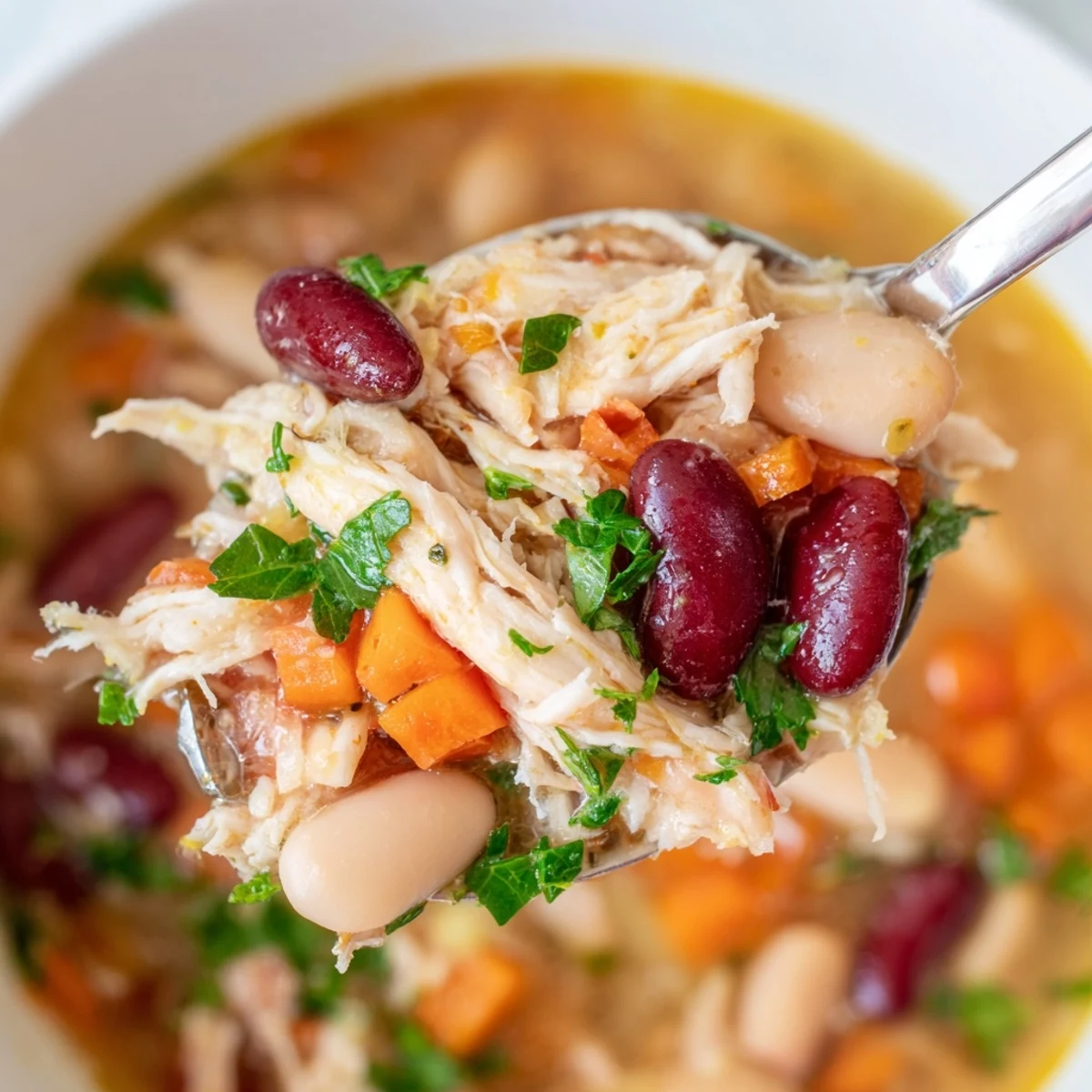 Serving suggestion for Creole Bean Soup with Turkey, ladled into a rustic bowl alongside crusty bread for a complete dinner.