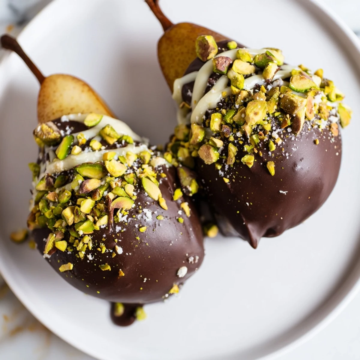 A close-up of Romantic Chocolate Covered Pears, ready for a romantic dessert platter with wine.