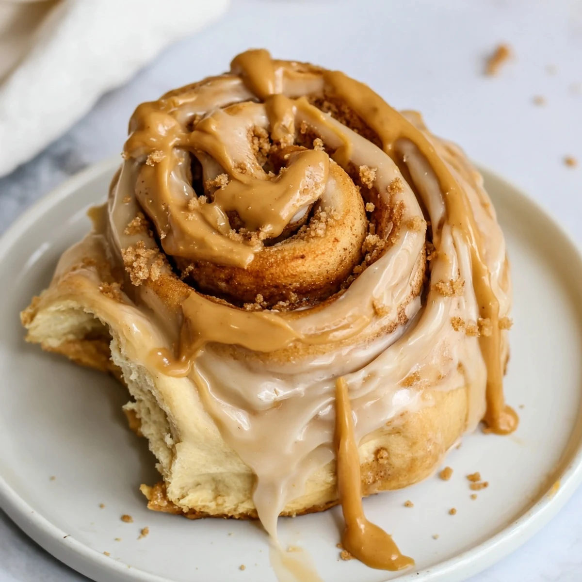 A platter of Soft and Gooey Biscoff Cinnamon Rolls ready for breakfast or brunch.