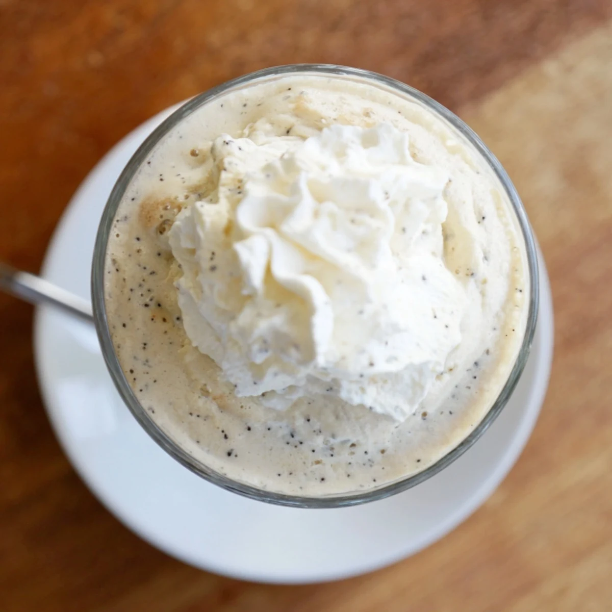 Two servings of the Vanilla Bean Frappuccino on a chilled surface, showcasing its smooth, frosty texture.