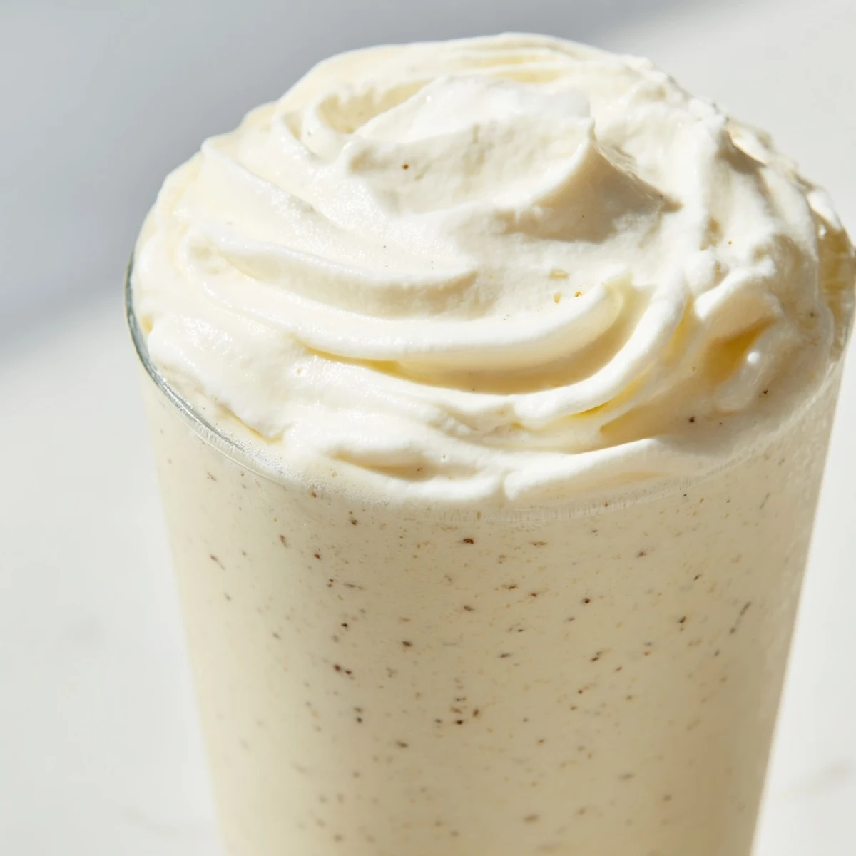 Enjoy a refreshing Starbucks Vanilla Bean Frappuccino, an indulgent blended beverage perfect for warm afternoons with a swirl of whipped cream.