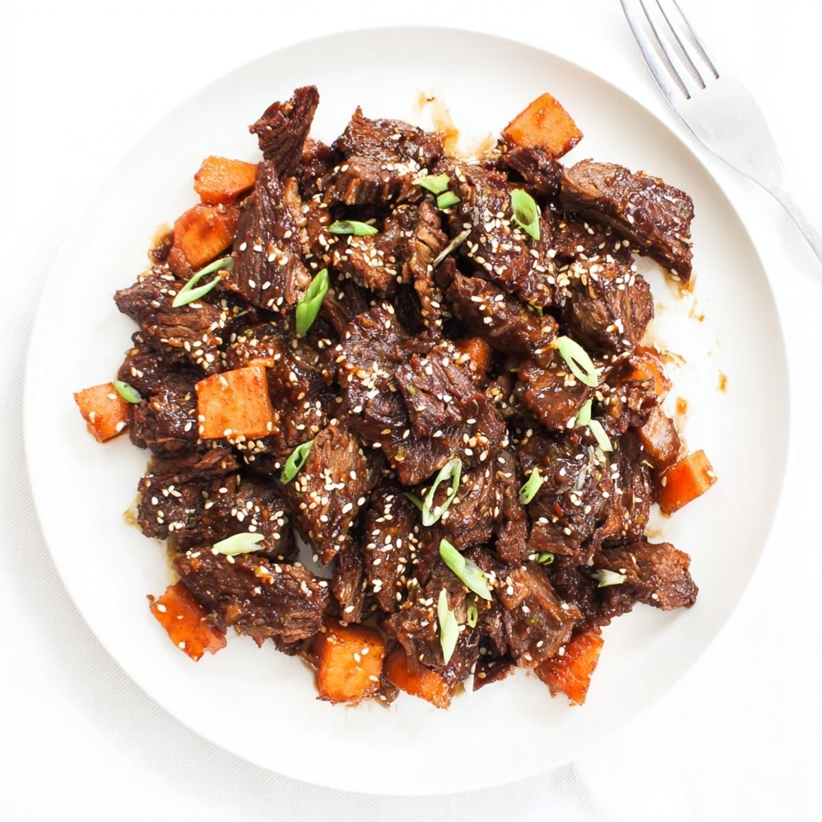 Juicy Korean Style Pot Roast simmered in a rich soy-ginger sauce, ready to be served over steamed rice.