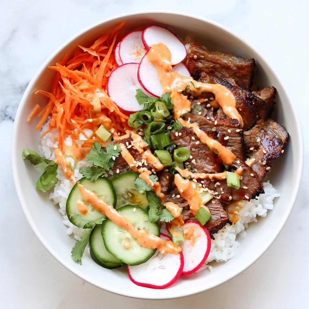 Sizzling steak, fresh radish, and creamy spicy sauce drizzled over warm rice for a Korean fusion dinner.