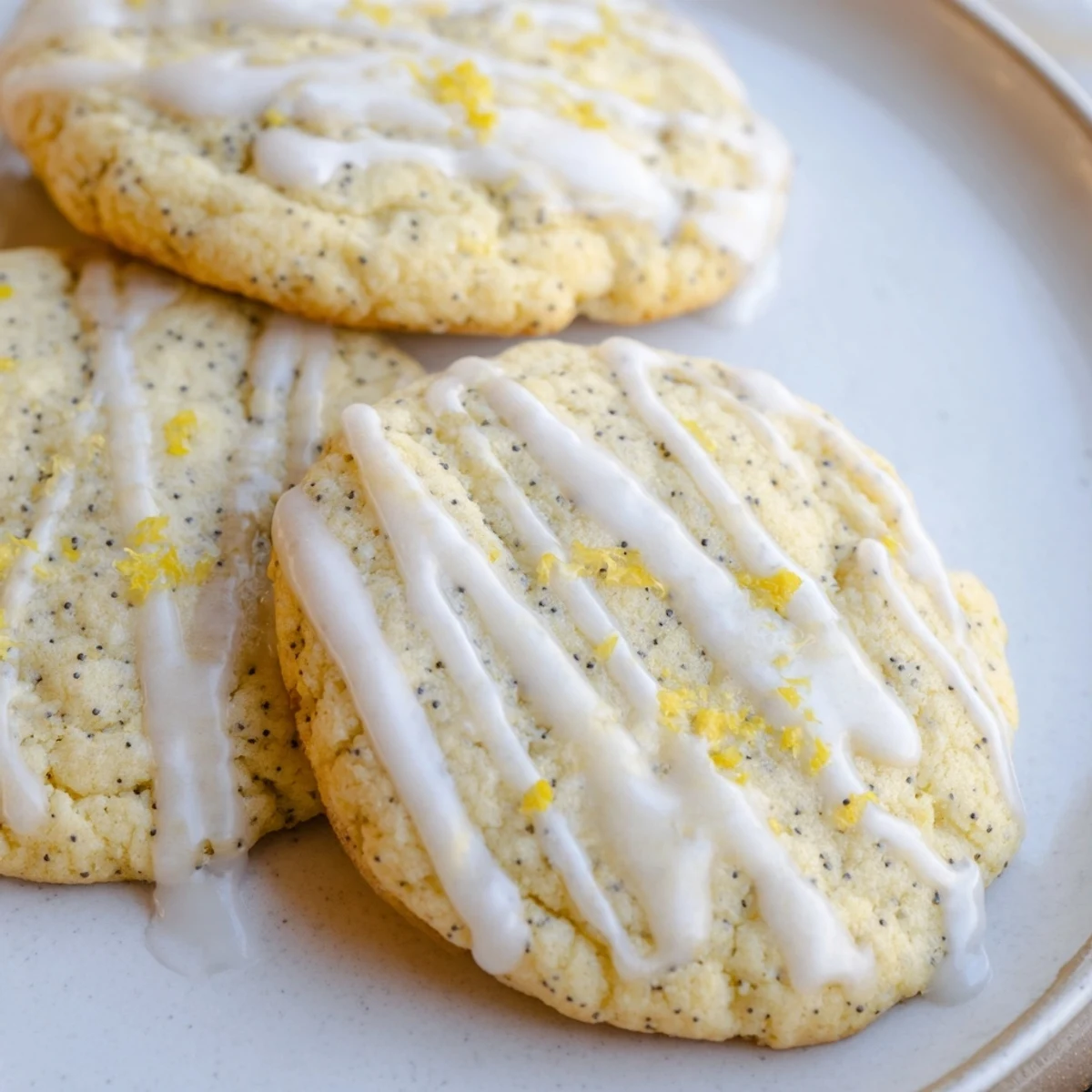 Chewy lemon poppy seed cookies with speckled dough and lightly browned edges fresh from the oven