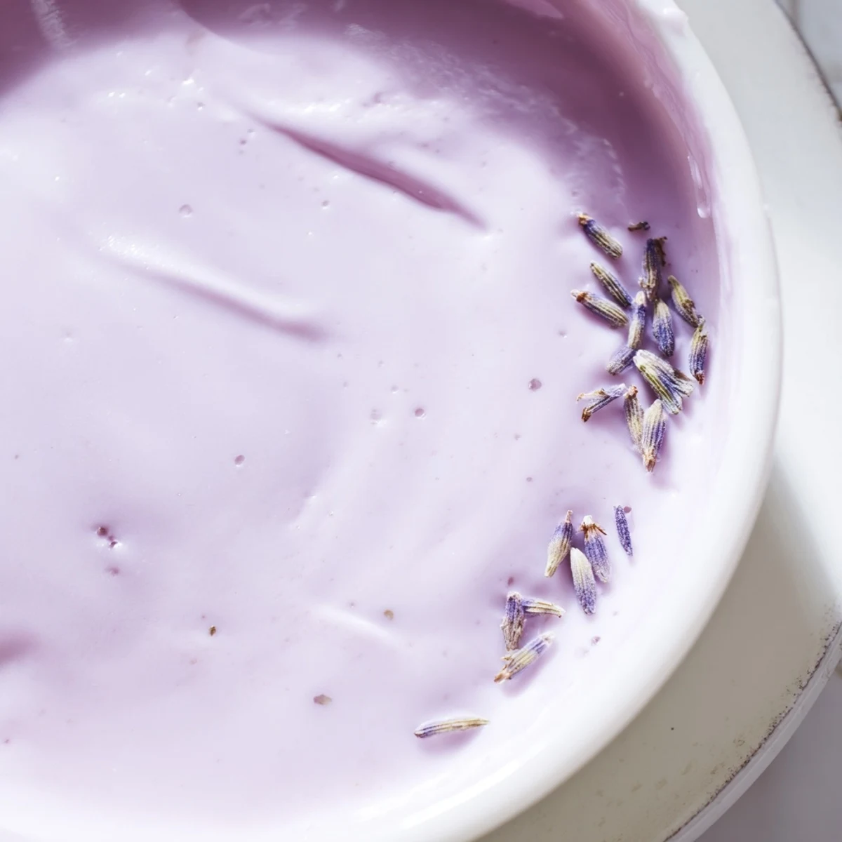 Smooth lavender glaze cascading down a golden pound cake with delicate floral aroma