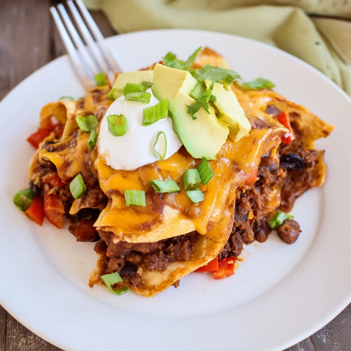 Beef Skillet Enchiladas bubbling with melted cheese, garnished with cilantro.