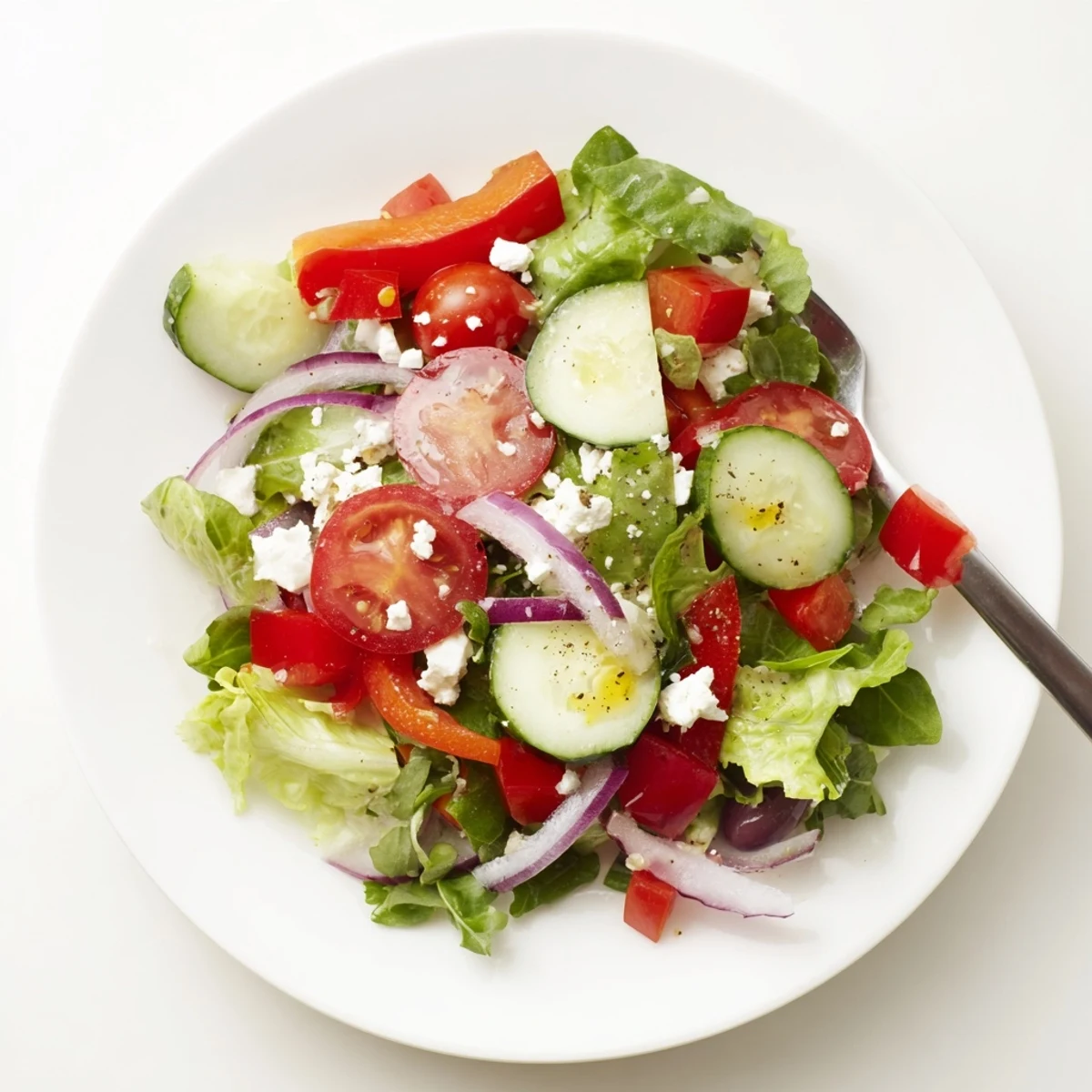 Bright Fresh Salad Recipe bursting with cherry tomatoes, crisp cucumbers, lemony dressing.