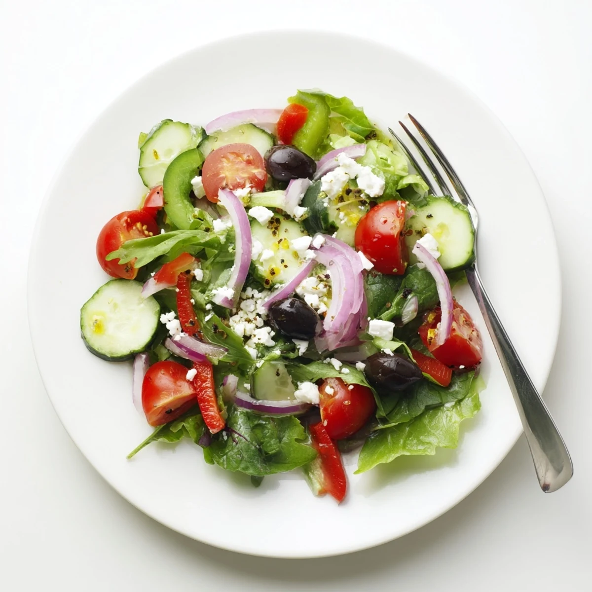 Bowl of Fresh Salad Recipe tossed in olive oil, ready to serve.