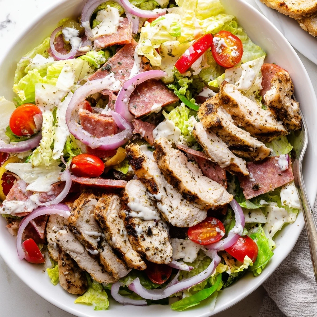 Italian Grinder Chicken Salad loaded with deli meats, pepperoncini, and creamy Italian dressing